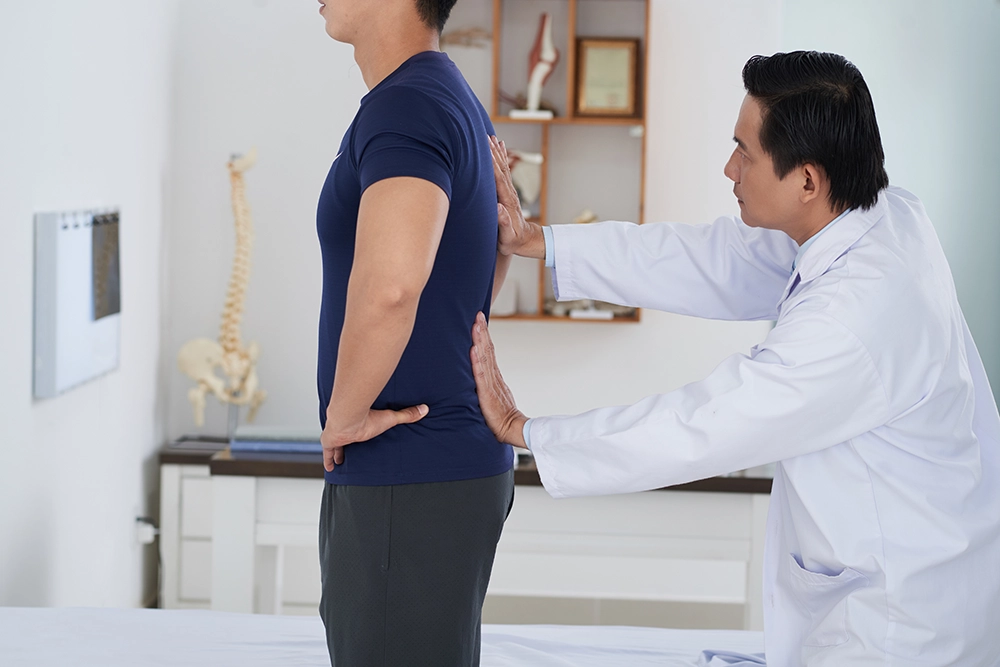Doctor performing physical therapy physical therapy for the spine