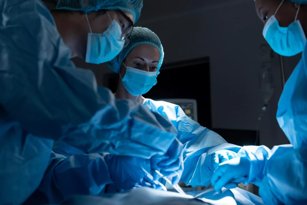 Doctors performing spine surgery