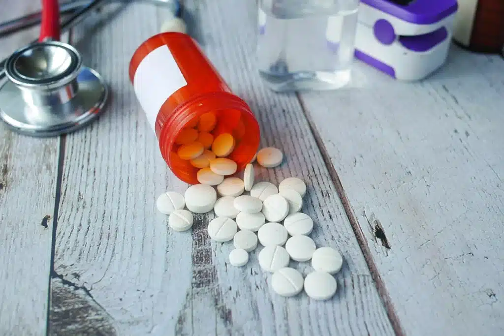 White pills spreading on a table