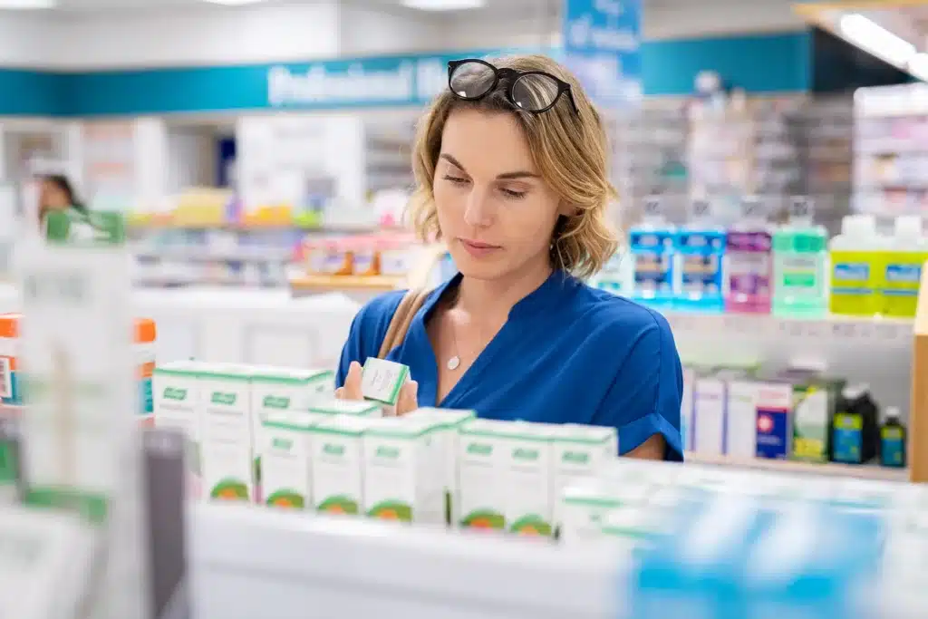 Woman reading indications in an non-opioid drug for pain