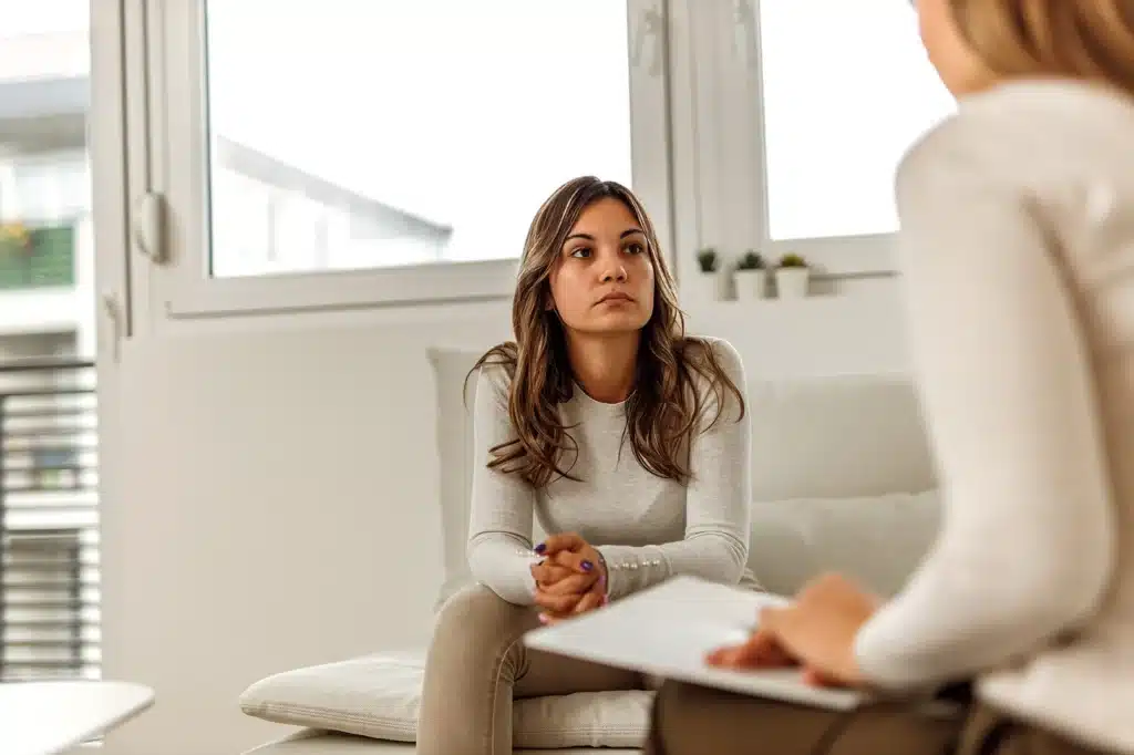young woman in consultation with a psychologist