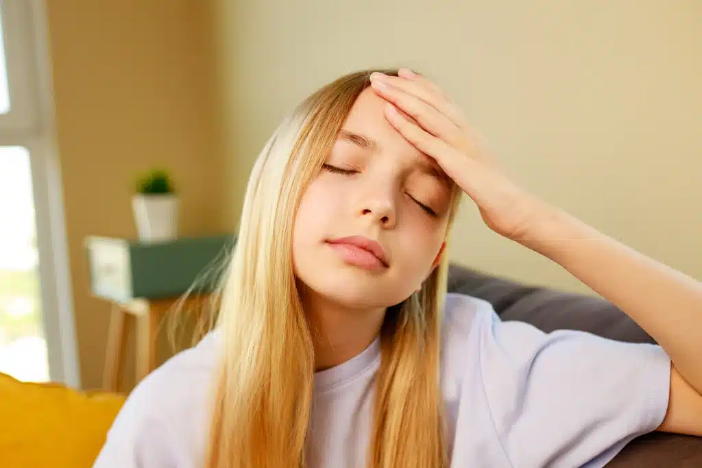 Young girl suffering headache