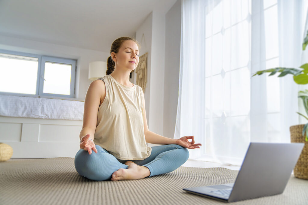 Young woman sitting comfortable practicing mindfulness