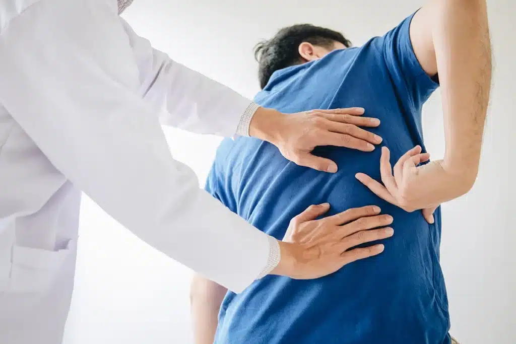 Back pain doctor examining a patient
