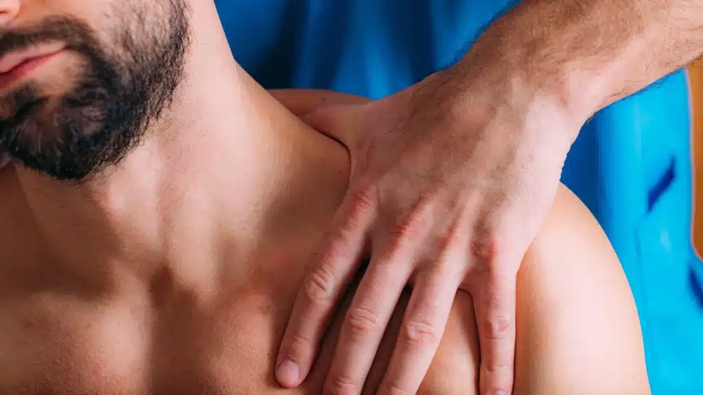 Sportsman receiving back pain relief massage