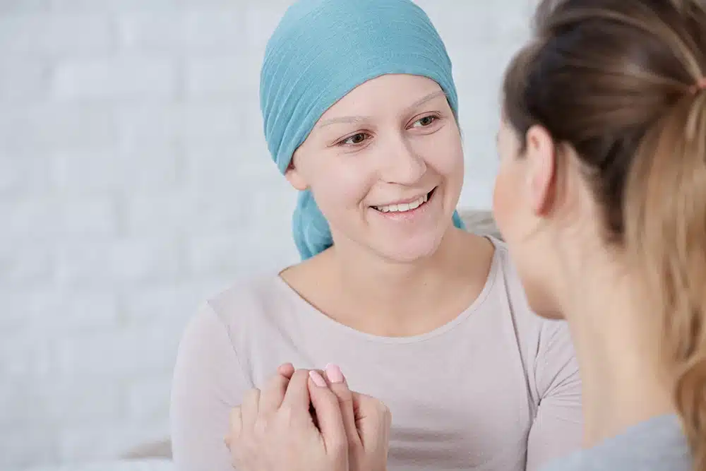 Doctor talking with patient, patient smiling