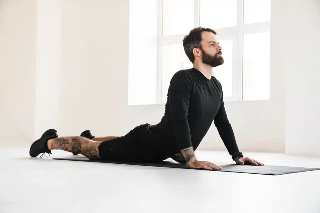Man practicing yoga for pain relief