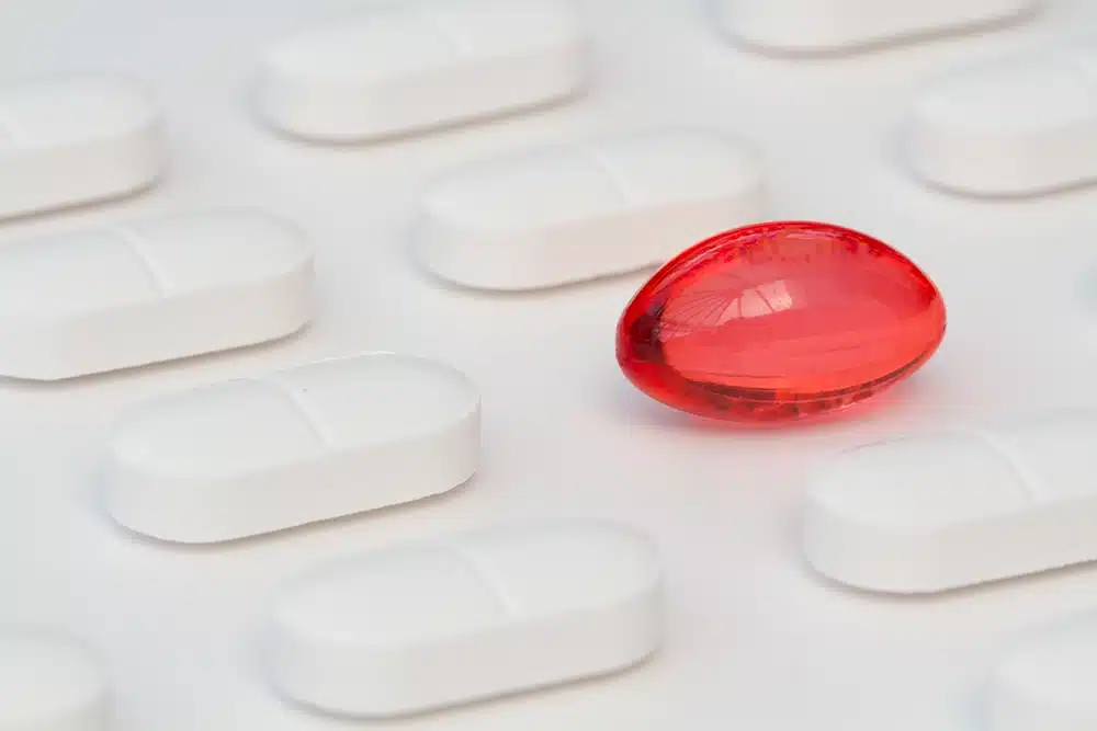 A close up photograph of a medicine pill