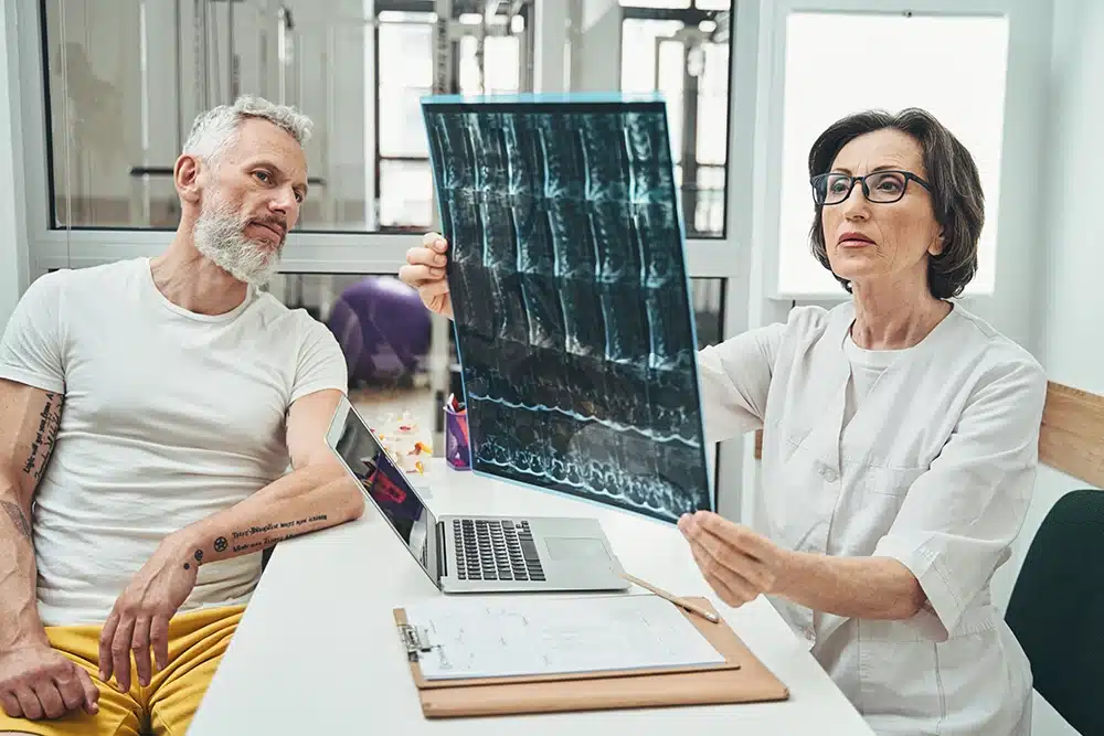 Patient looking over his x-rays with his doctor