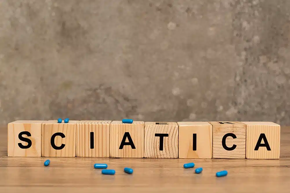 wooden cubes with letters on them spelling Sciatica