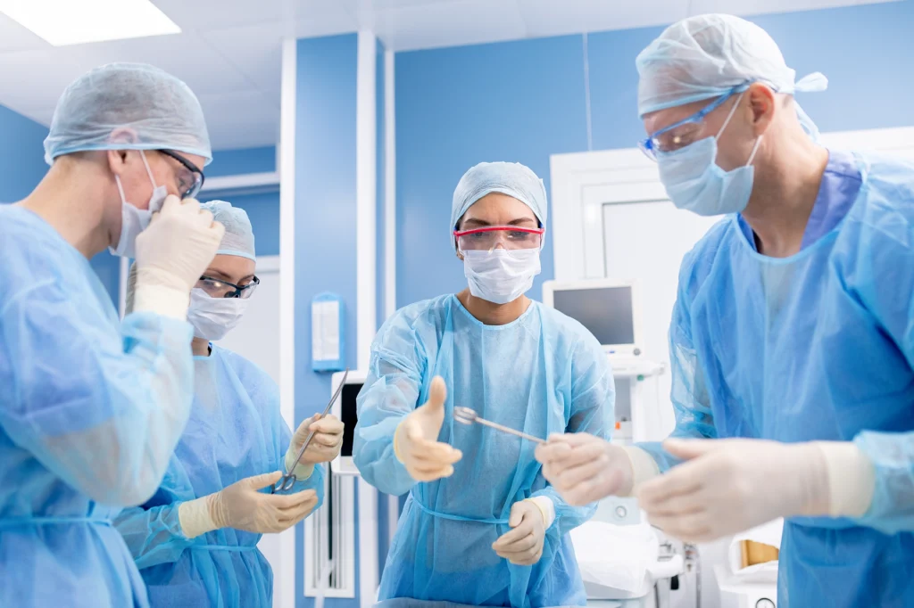 Surgical team performing a thoracic spinal fusion in a modern operating room.