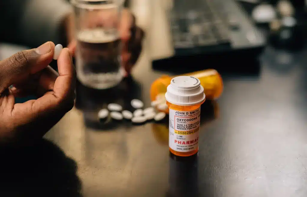 Bottles of prescribed opioids with a focus on safe and responsible pain management.