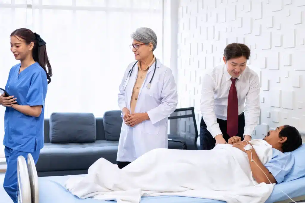 Family members visiting a patient in a pain management clinic, highlighting supportive care in New York’s pain management facilities.